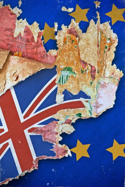 Grunge paper with UK flag on the wallpaper break away from the European Union. Concept Brexit. Old grunge tattered wall cover in a ruined house.