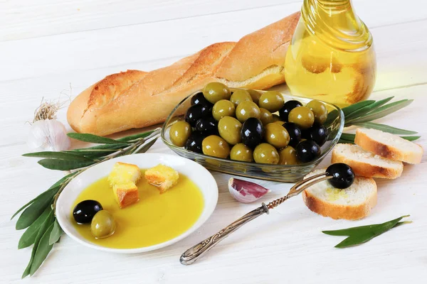Olives, olive oil, bread and garlic