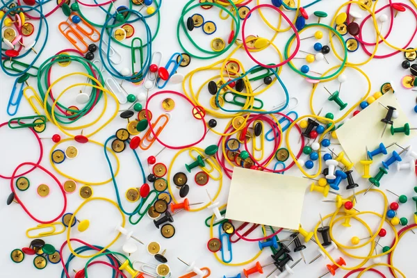 Colourful paper clips, drawing pins thumb tacks, elastic rubber