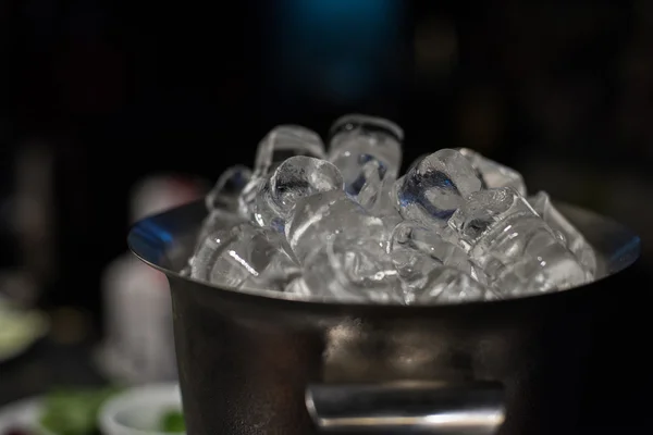 Ice bucket with ice cubes