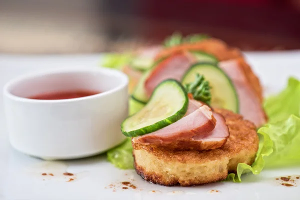 Pancakes with ham and cucumber