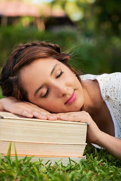 Girl sleep on books