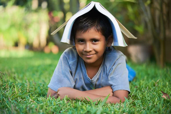 Kid with book on head