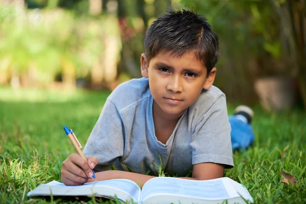 Kid with book at the park