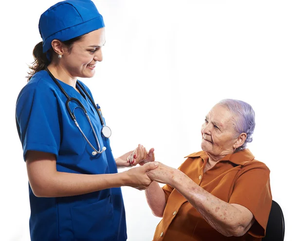 Patient old woman with doctor