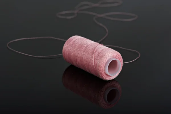 Pink thread on black