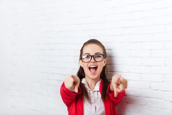 Businesswoman happy excited laughing point finger at you wear red jacket glasses smile