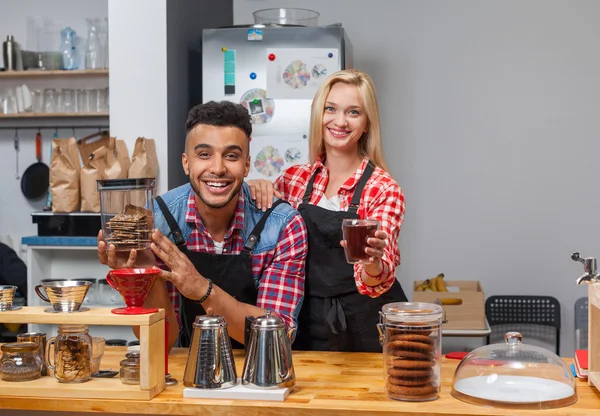 Barista coffee shop owner couple happy smile at bar counter