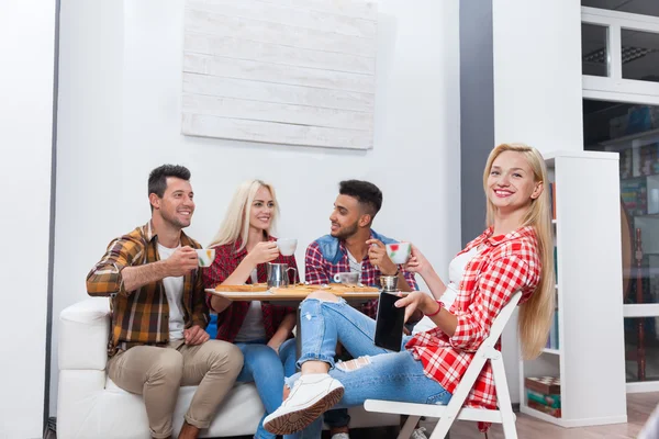Young people drink coffee shop, friends sitting table smiling