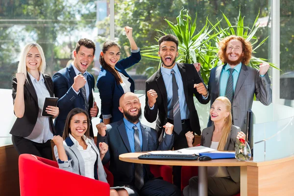 Business People Group Sit At Desk, Successful Excited Team In Modern Office, Businesspeople Happy Smile With Raised Hands