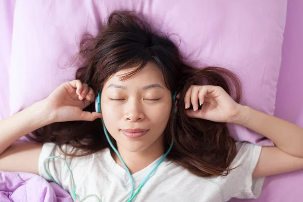 Asian young girl listening  music