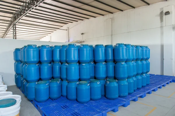 Blue Plastic barrels contain