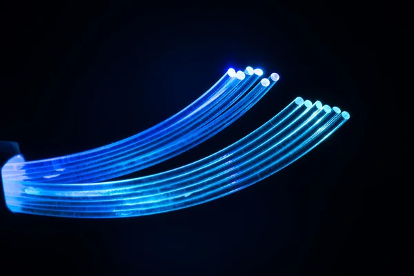 Optical fibres dinamic flying from deep on technology background