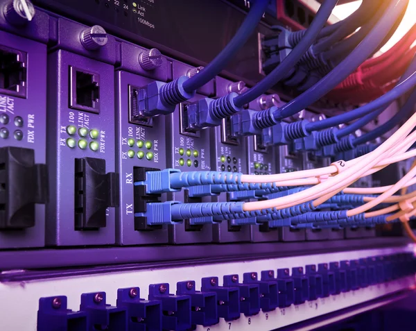 Fiber Optic cables connected to an optic ports and Network cable