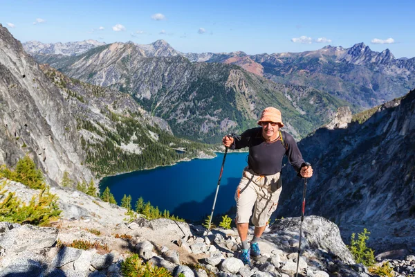 Hiking man in mountains in Canada