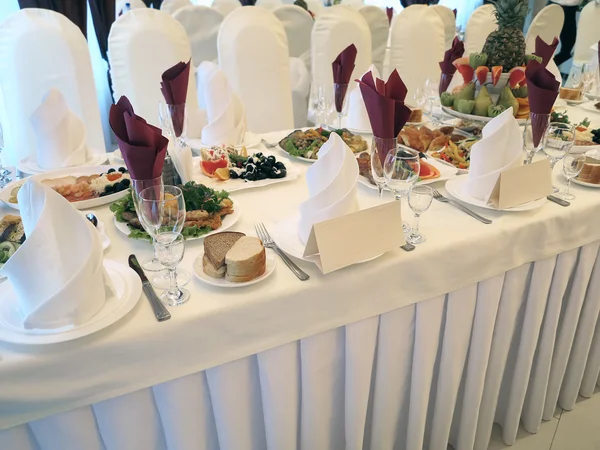 Decorated dining table reception with plates and serviettes