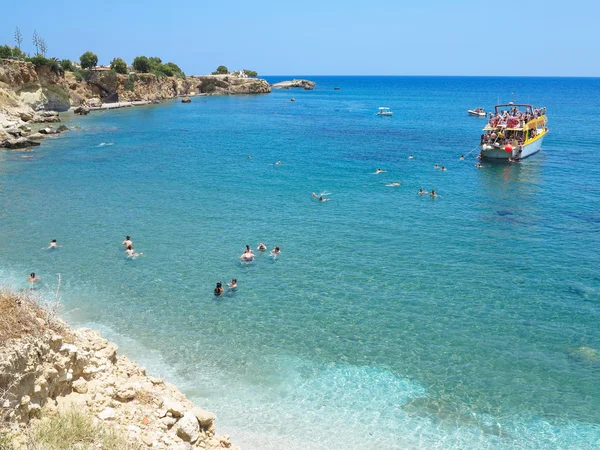22.06.2015, Crete, Greece, Tourist boat and swiming in the lagoo