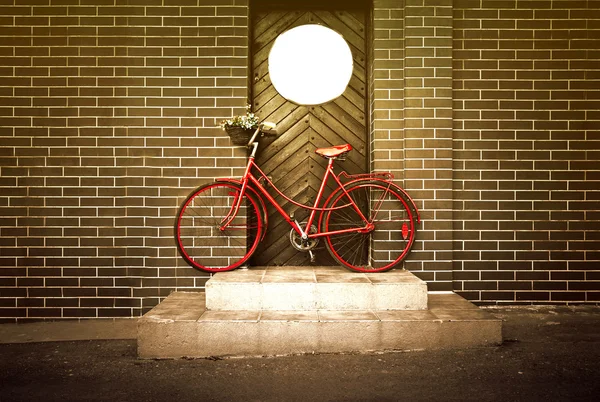 Vintage retro old red bike on the street.