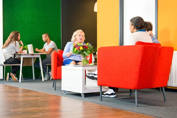 People sitting in a business lounge