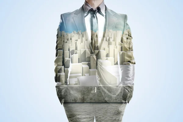 Double exposure of business man and city skyline