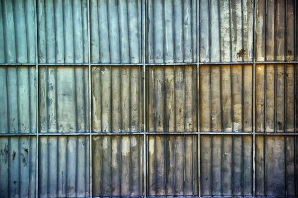 Rusty aluminum metal platted garage wall