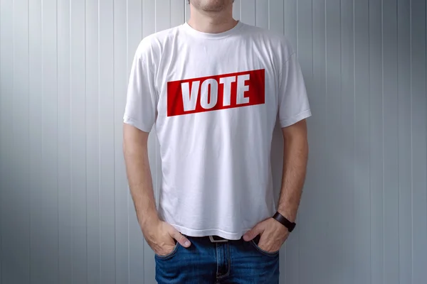 Man wearing t-shirt with Vote label
