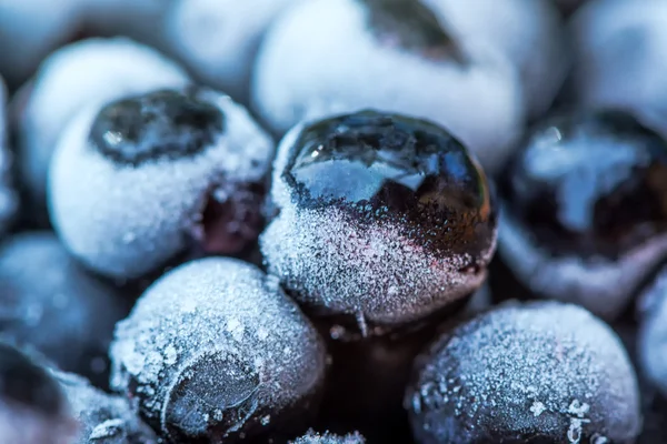 Frozen aronia chokeberry berries in a bowl