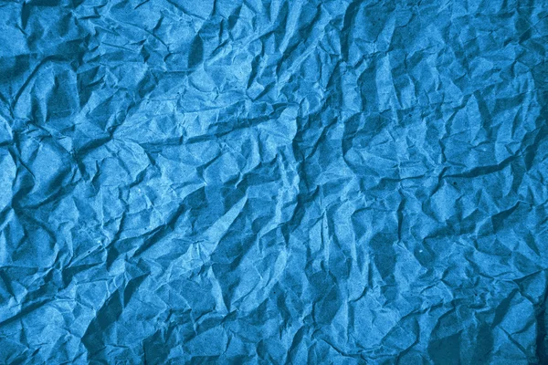 Rough blue crumpled paper texture as background