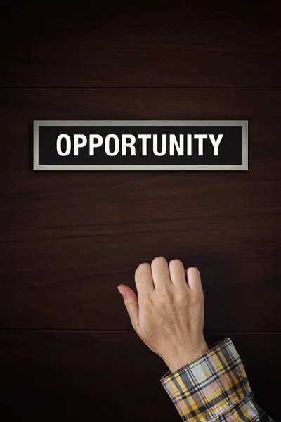 Hand is knocking on the doors of Opportunity