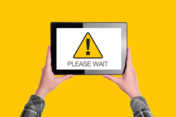 Please Wait Message on Digital Tablet Computer Display