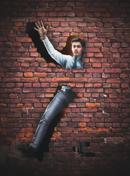 Businessman in the brick wall