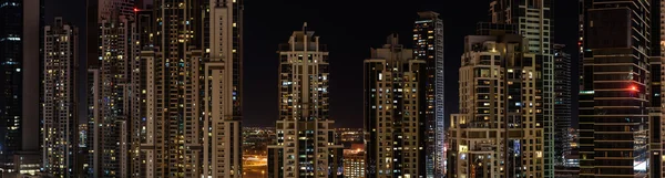 Panorama of new residential buildings in Dubai at nigh