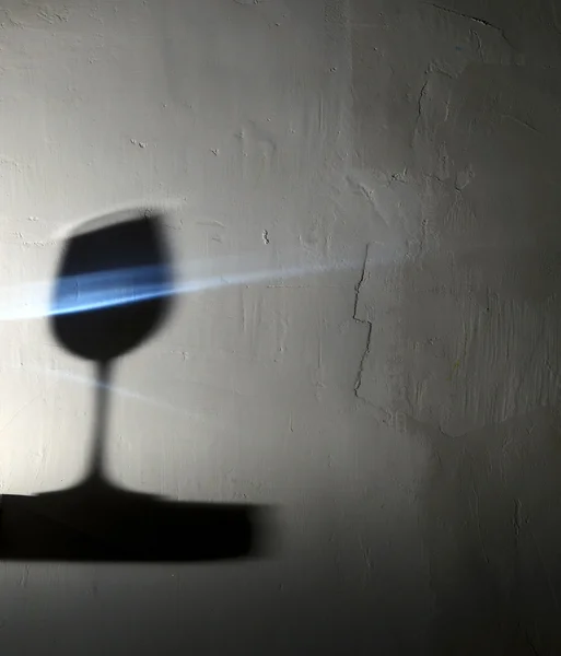 Shadow of the glasses with blue drink