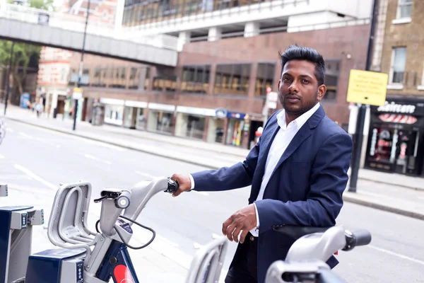 Indian business man with a bike