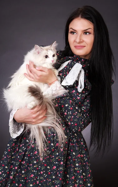 Young attractive woman with a cat