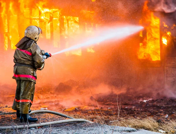 Fireman extinguishes a fire