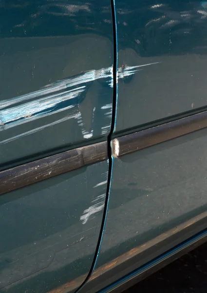 Scratched door paint on a car