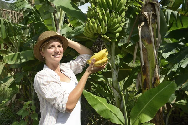 Woman visiting banana plantation