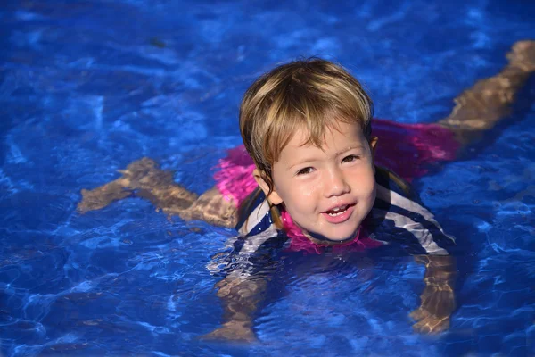 Baby girl is learning how to swim