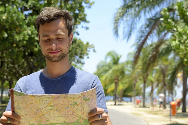 Male tourist with map