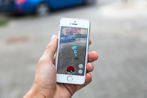 Pokemon Go game on screen of iPhone