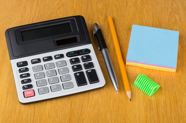 Electronic calculator, paper, pen, sharpener  and pencil