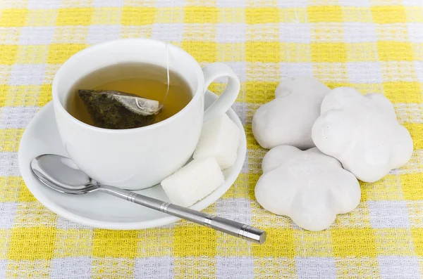 Hot tea, sugar and heap of gingerbread