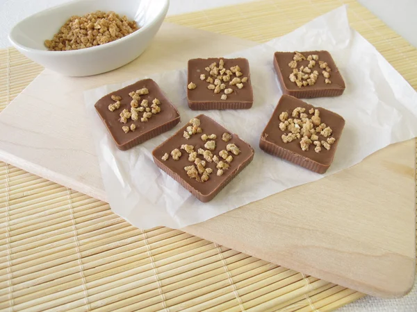 Homemade chocolate with almond brittle