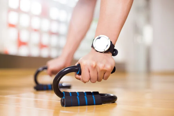 Asian man works out in modern gym