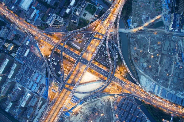 Aerial view of traffic on road junction at night