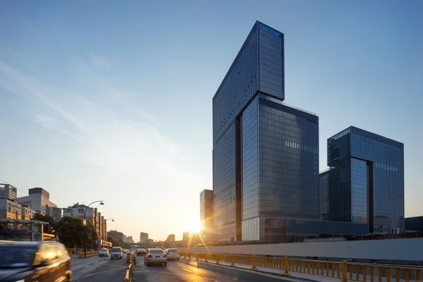 Business buildings in modern city at sunrise