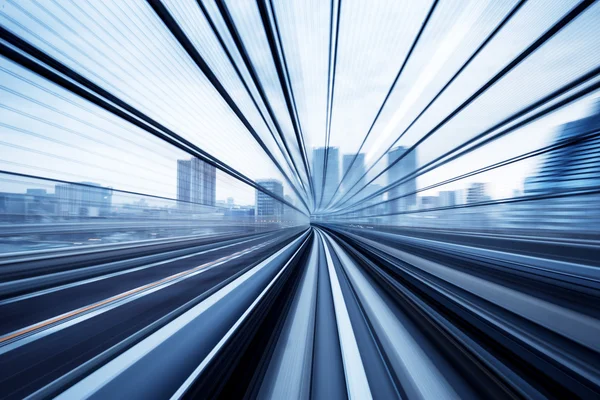 Cityscape and rail track in Tokyo from speed train