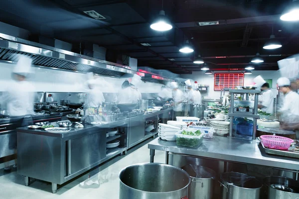 Modern kitchen and busy chefs in hotel