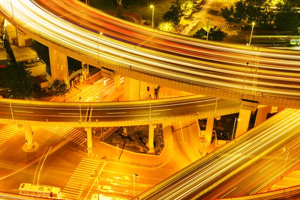 Illuminated road intersection and traffic trails